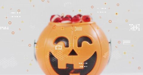Halloween Jack-o'-Lantern Candy Bucket Holding Red Sweets with Tech HUD Overlay, Closeup