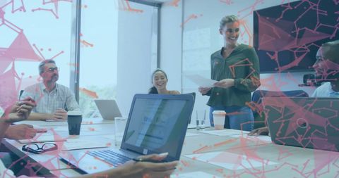 Diverse Team Collaborating in Modern Office with Digital Network Overlay