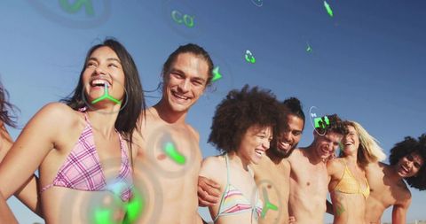 Group of Friends Enjoying Beach Day with Digital Icons Floating