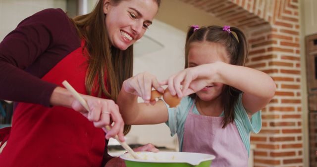 Mother and Daughter Baking in Kitchen with Joyful Smiles - Download Free Stock Images Pikwizard.com