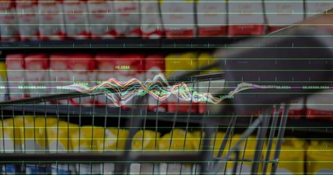 Grocery cart handle in market aisle with blurred jars and retail analytics overlay