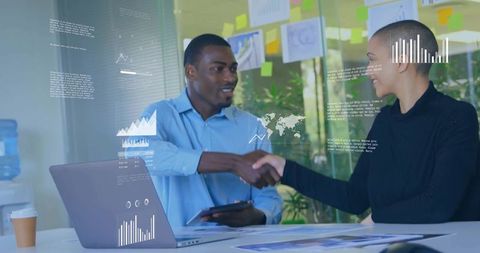 Business Professionals Handshake in Modern Meeting Room