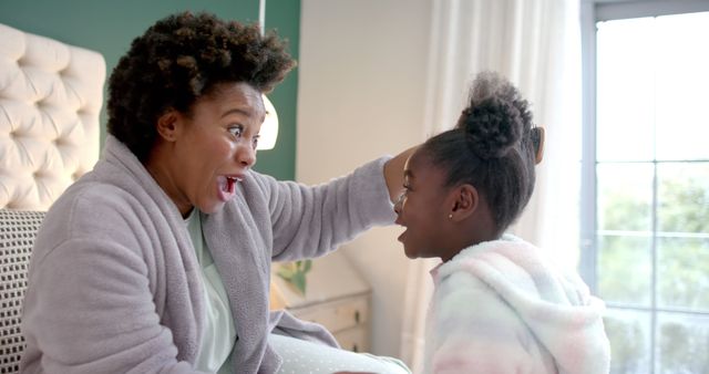 Mother and Daughter Sharing Fun Moment at Home - Download Free Stock Images Pikwizard.com