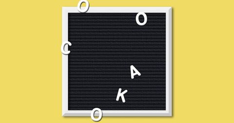 Letter board letters scattered on yellow background