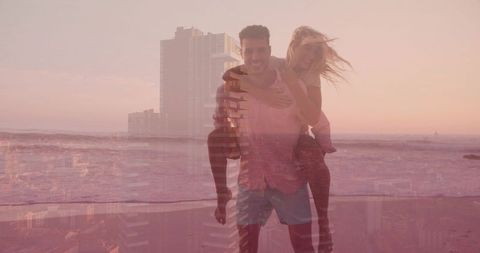 Couple walking on beach at sunset with city double exposure, romantic seaside lifestyle