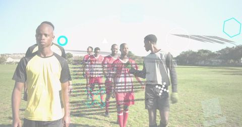 Young soccer players walking across field after match showing team unity and sportsmanship