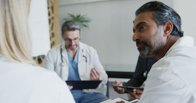 Medical Professionals Discussing Patient Case During Meeting - Download Free Stock Images Pikwizard.com