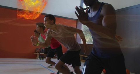 Four Male Athletes in Sprint Drill Inside Gym with Basketball