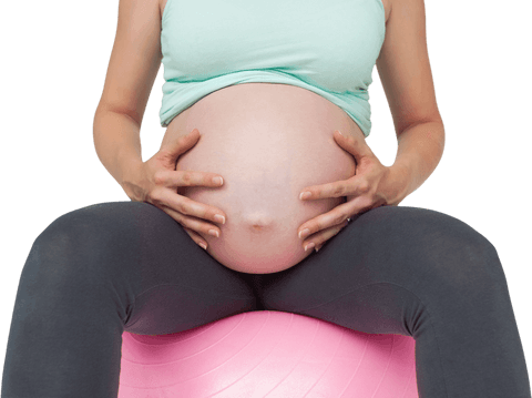 pregnant woman sitting on transparent exercise ball embracing bump - Download Free Stock Videos Pikwizard.com