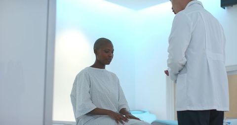 African patient consulting korean physician during clinical examination in modern clinic