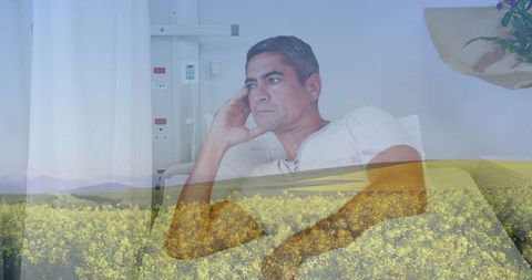 Contemplative patient double exposure blending hospital bed and blooming meadow