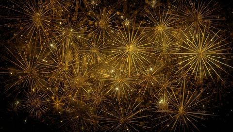 Shimmering gold firework starbursts filling night sky with radiant sparks