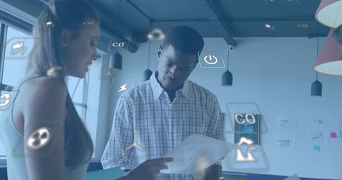 Reviewing document with ar overlays in modern open-plan office, team collaborating