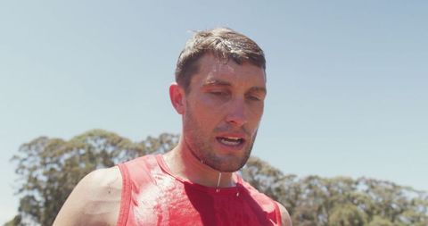 Exhausted athlete cooling down after intense workout
