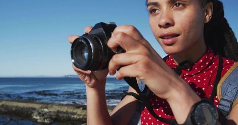 Woman Photographer Enjoying Seaside Adventure