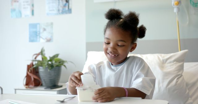 Child Smiling While Eating in Hospital Room - Download Free Stock Images Pikwizard.com