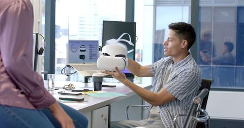 Colleagues Collaborating on Virtual Reality Innovation in Modern Office