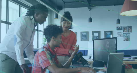 Diverse Team Collaborating in Modern Digital Workspace with Technology Overlay