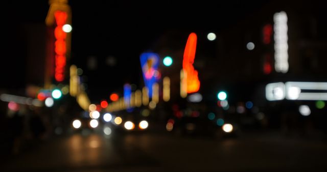 Blurry city landscape with vibrant neon lights and active traffic on a night street. Ideal for use in urban life, travel blogs, and night-time city experience promotions. Can be utilized in creative presentations about cityscapes, nightlife, electric ambiance, and urban transportation industries.