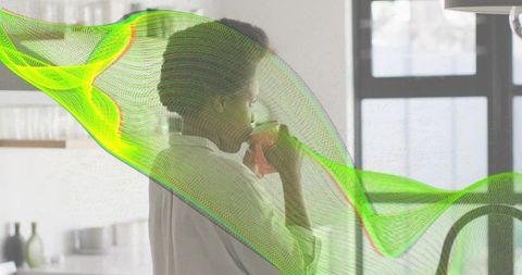 Woman sipping coffee by window with neon digital mesh overlay, modern minimalist interior