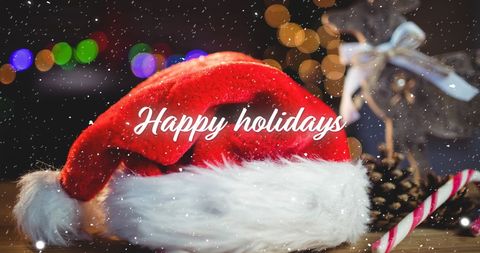 Festive Santa Hat with Christmas Decorations and Snow