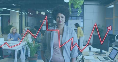 Confident Businesswoman with Rising Financial Graph in Modern Office - Download Free Stock Images Pikwizard.com