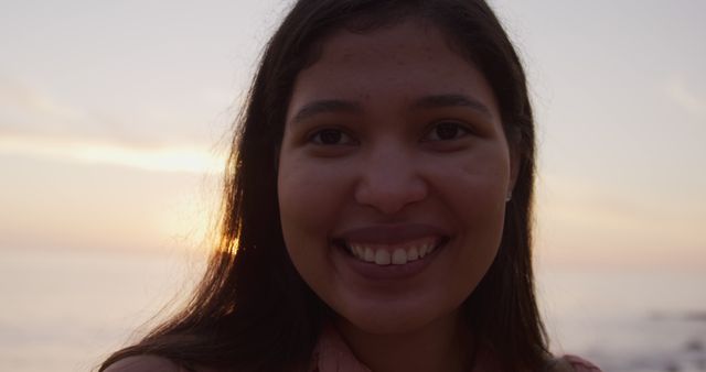 Young Woman Smiling at Sunset Beach - Download Free Stock Images Pikwizard.com