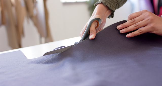 Person Cutting Fabric with Scissors in Workshop - Download Free Stock Images Pikwizard.com