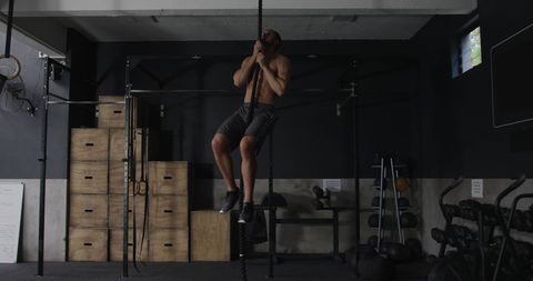 Athletic Man Perform Rope Climb Cross Training Workout Gym Setting - Download Free Stock Images Pikwizard.com