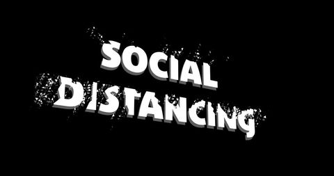 Dissolving Social Distancing Text on Black Background