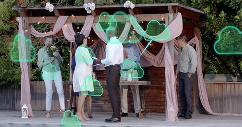 Intimate outdoor wedding vows with augmented reality cloud overlays under draped pergola