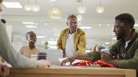 Diverse Team Collaboration in Modern Workspace with Digital Network Graphics