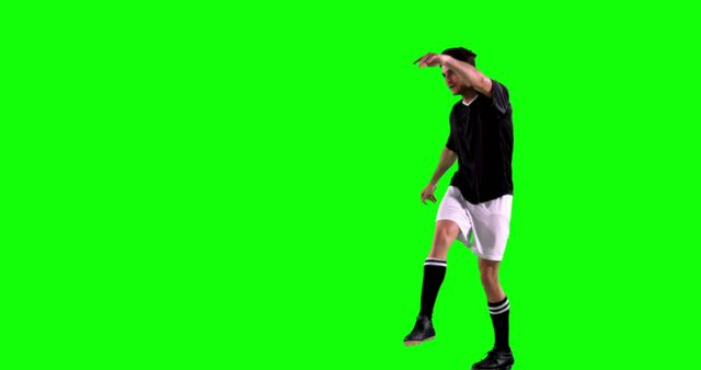 Soccer Player in Mid-Action with Green Screen Background - Download Free Stock Images Pikwizard.com