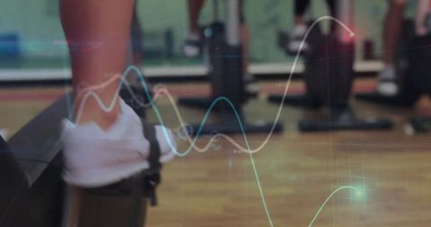 Athlete performing step exercises in modern gym environment