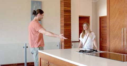 Friends Enjoying Casual Conversation in Modern Kitchen