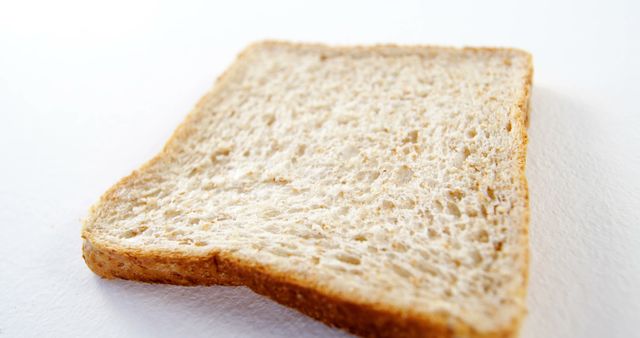 Slice of Whole Wheat Bread on White Background - Download Free Stock Images Pikwizard.com