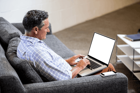 Businessman on Sofa Using Laptop with Blank Screen, Seamless Transparent Concept - Download Free Stock Videos Pikwizard.com