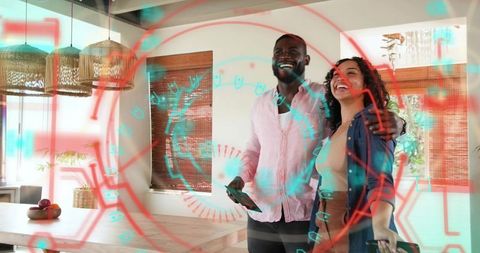 Couple exploring augmented reality design using tablet and phone in sunlit minimalist dining