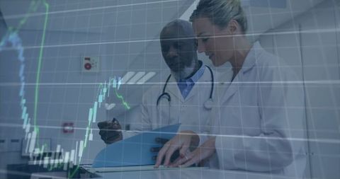 Doctors reviewing medical data with digital charts overlaying clinic for healthcare analytics