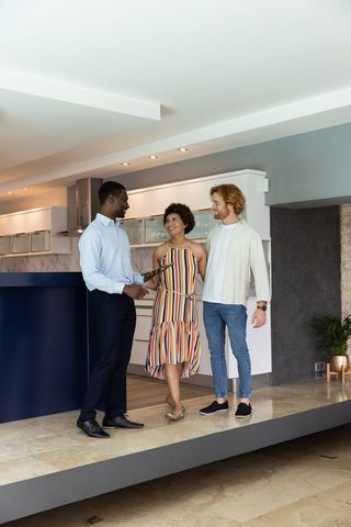 Professionals Discuss Modern Kitchen Design with Clients