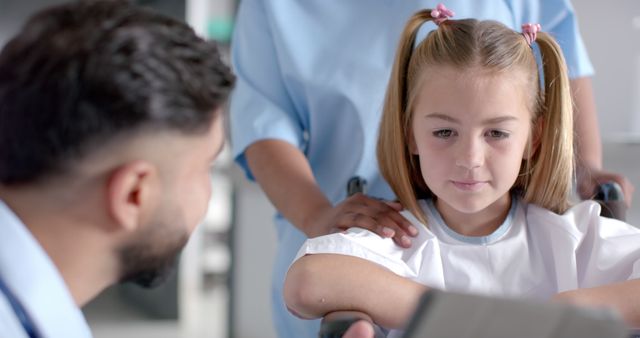 Female Doctor Caring for Young Girl in Hospital - Download Free Stock Images Pikwizard.com