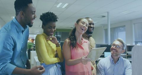 Multicultural Team Collaborating with Tablet in Modern Office