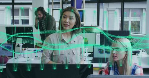 Confident Woman Presenting Data Overlay in Shared Office Workspace