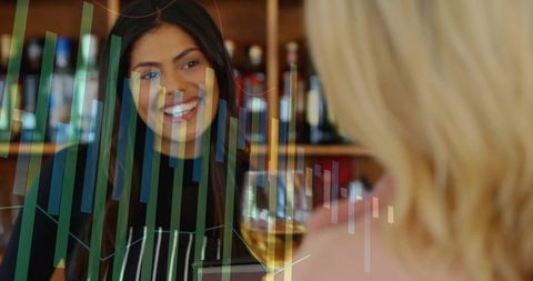 Smiling server welcoming guest at rustic wine bar, serving tasting glass and friendly chat