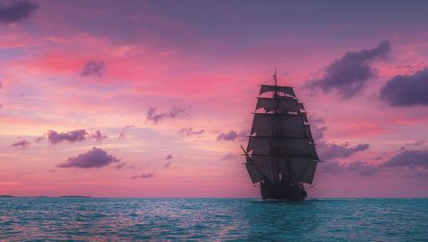Majestic Sailing Ship at Sunrise Over Calm Ocean