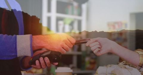 Customer conducting easy payment with credit card in grocery store