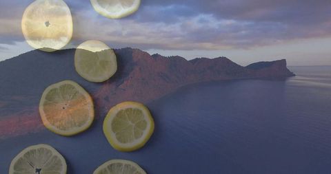 Surreal dusk coastline with translucent lemon slices