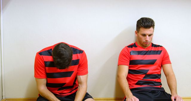 Two Soccer Players Sitting in Locker Room after Game - Download Free Stock Images Pikwizard.com