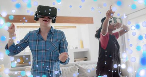 Teen Girls Dancing with VR Headsets in Virtual World