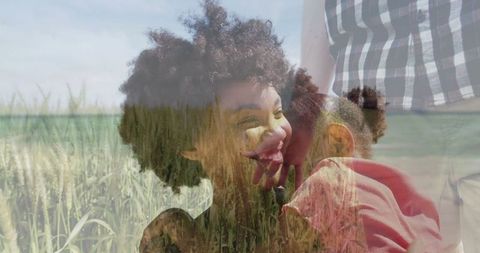 Joyful Family Embraces in Lush Green Field on Sunny Day